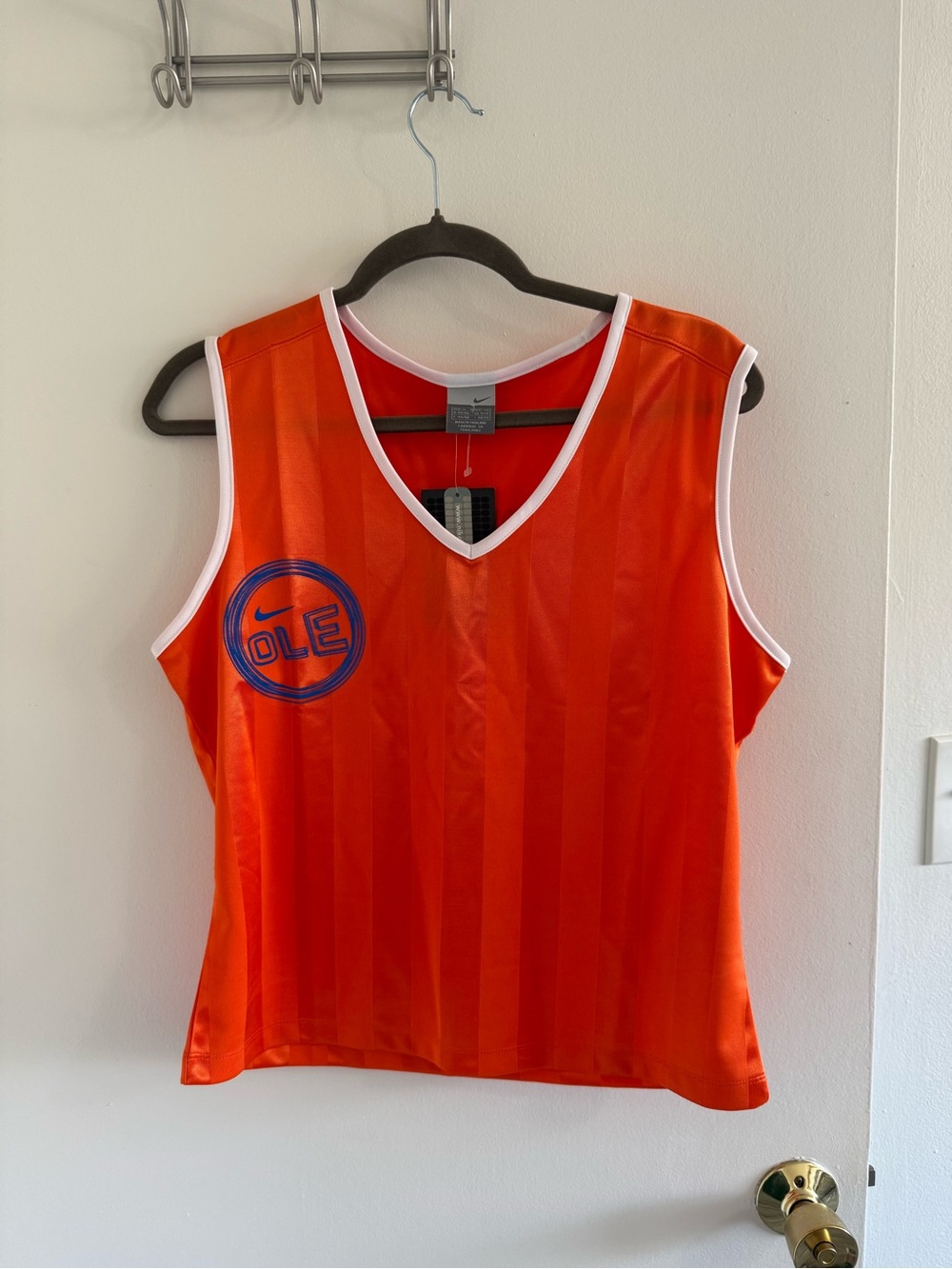 Nike Women’s Orange Sleeveless V-Neck Jersey with Blue Logo